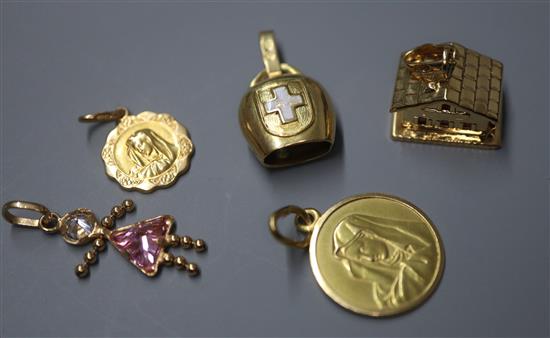 Four 18ct gold charms, comprising a cow bell, a chalet and two Madonnas and a 9ct gold gem-set doll charm